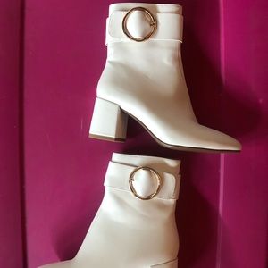 Fashionable and fun white booties.